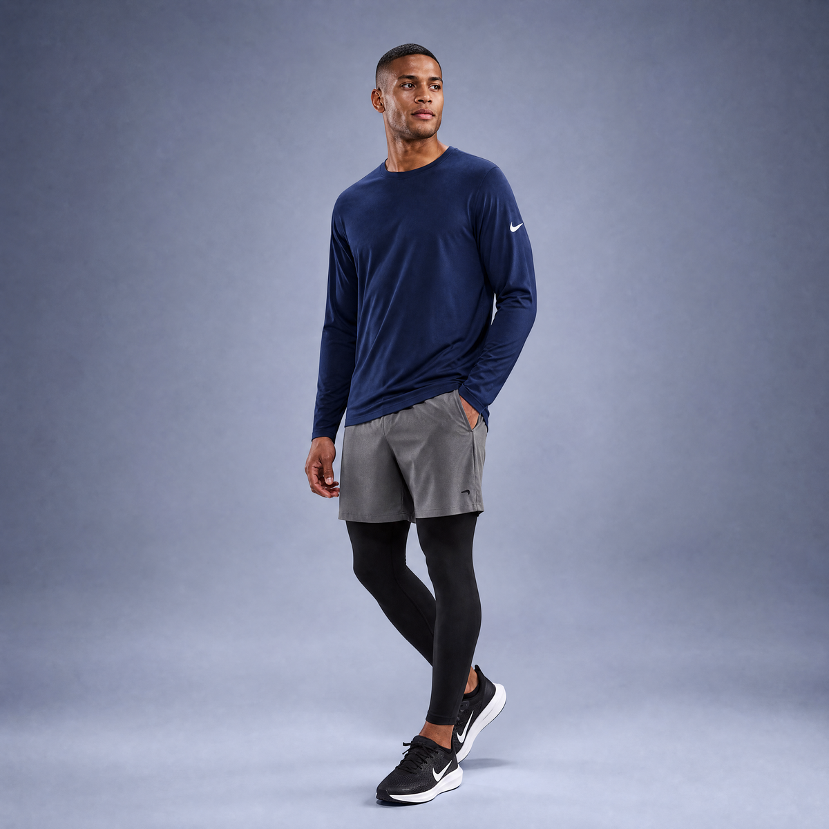 Male athlete modeling the navy Nike Cotton Long Sleeve Men's Tee