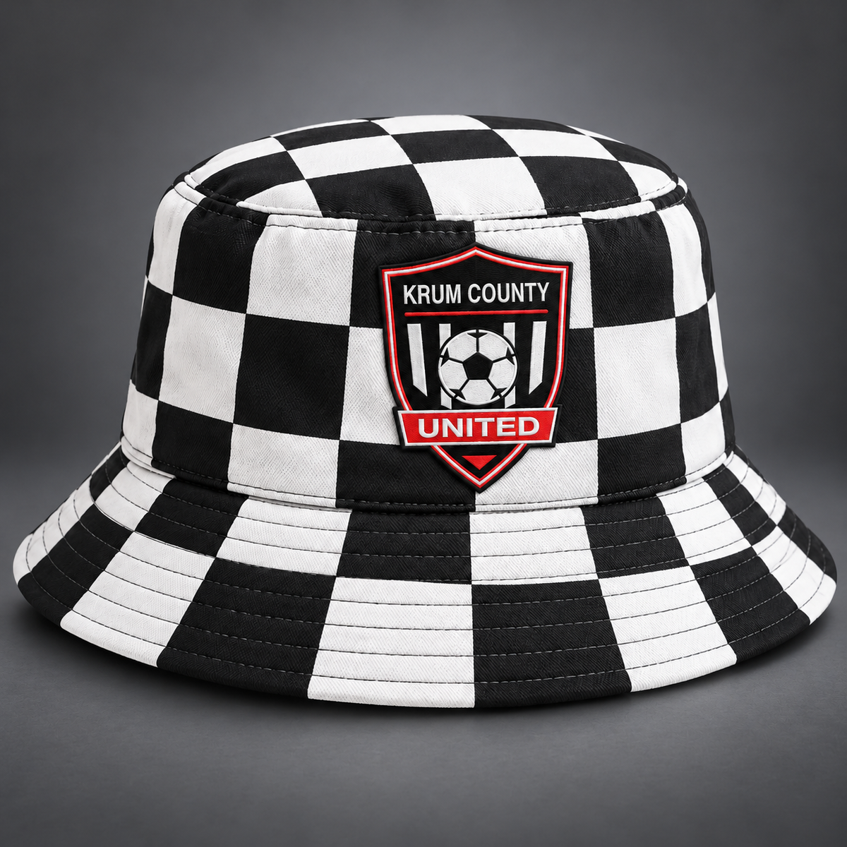 Black and white checker Krum County United bucket hat with a full-color crest patch.