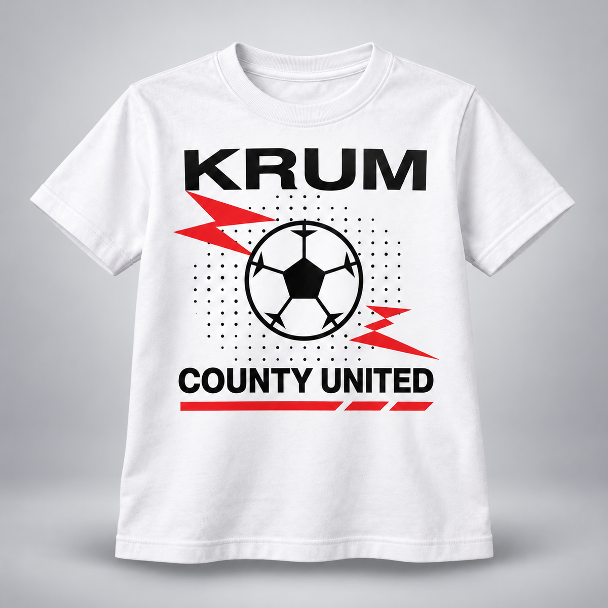 White youth Krum County United tee with a large soccer-ball burst and red speed graphics.